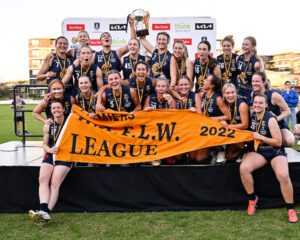 WAFLW 2022 team photo, team holding up a cup and their banner